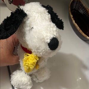 Plush Snoopy holding Woodstock